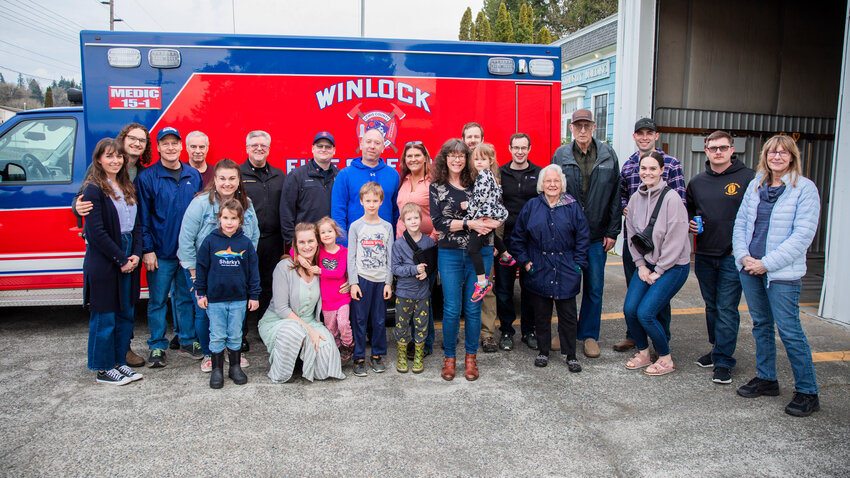 Danny Peterson, 6, stands front and center with his arm in a sling Saturday in Winlock while surrounded by friends, family, paramedics, fire personnel, members of the Winlock community and a couple from Ryderwood who were in the vehicle that struck Peterson in March.