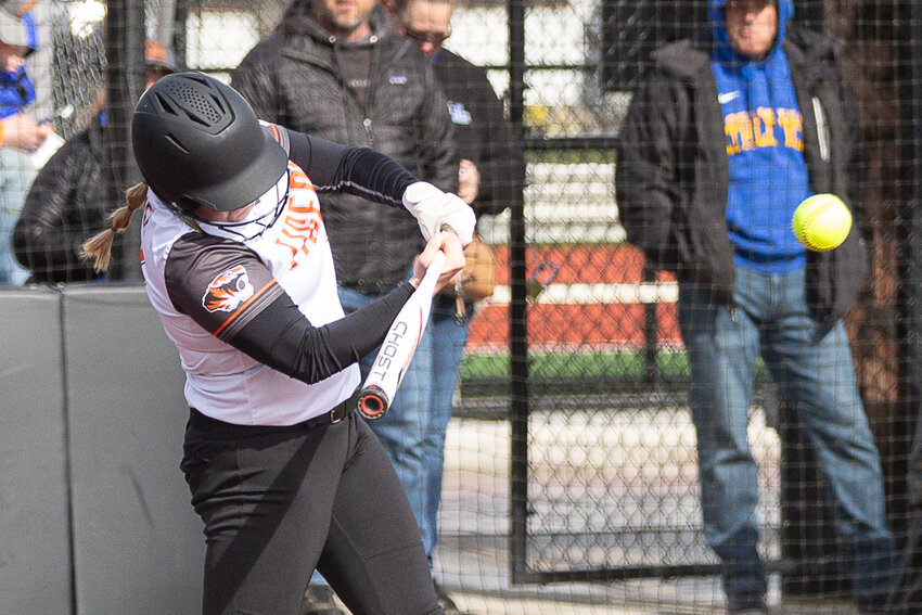Centralia's Payton Baumel makes contact with a pitch against Rochester at Rec Park April 19.