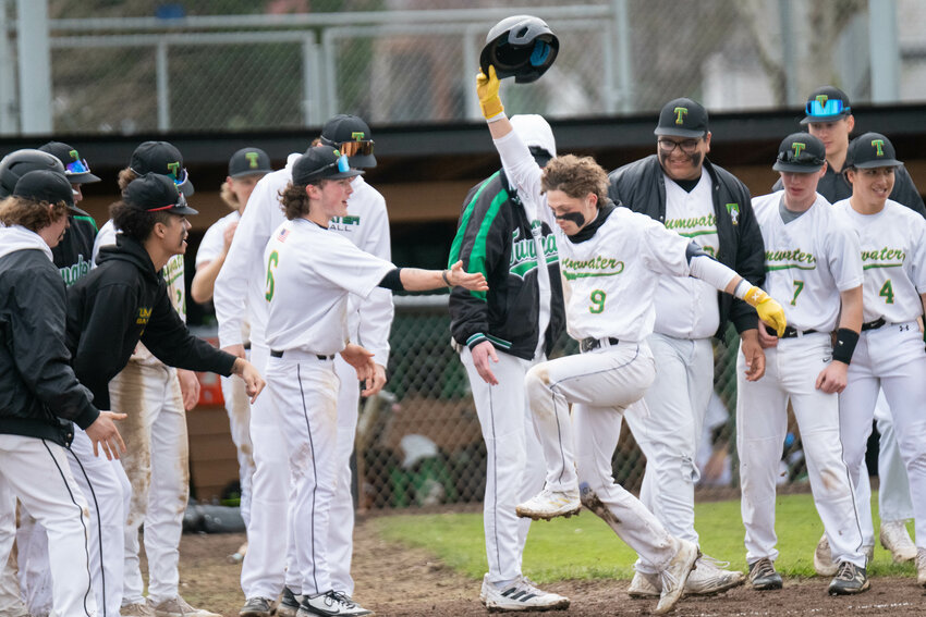 Tumwater's Eddie Marson takes one big step to end his home-run trot after going yard during the T-Birds' 10-0 win over W.F. West on April 21.