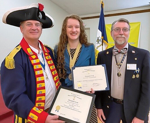 Elizabeth Swift is congratulated for her winning essay and oration by Washington State SAR Society President Dr. Keith Weissinger, right, and Ft. Vancouver SAR Chapter President Allen Furlow.