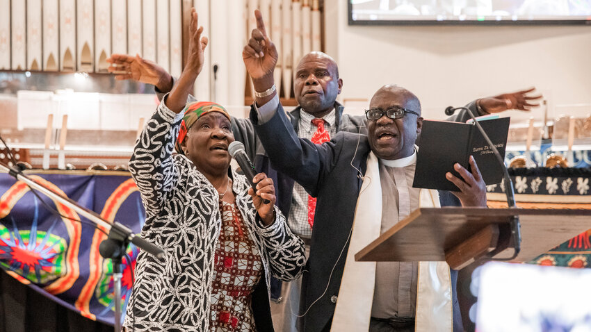 Reverend Doctor Howard Matiya Nkhoma and wife of over 55 years, Mariya, perform a song and traditional dance alongside Owen Singini at Westminster Presbyterian Church in Chehalis on Sunday.