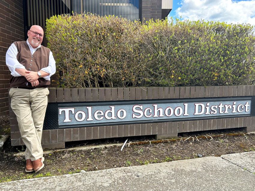 Retiring Toledo School District Superintendent Chris Rust smiles outside the district office on April 12, 2023.&nbsp;