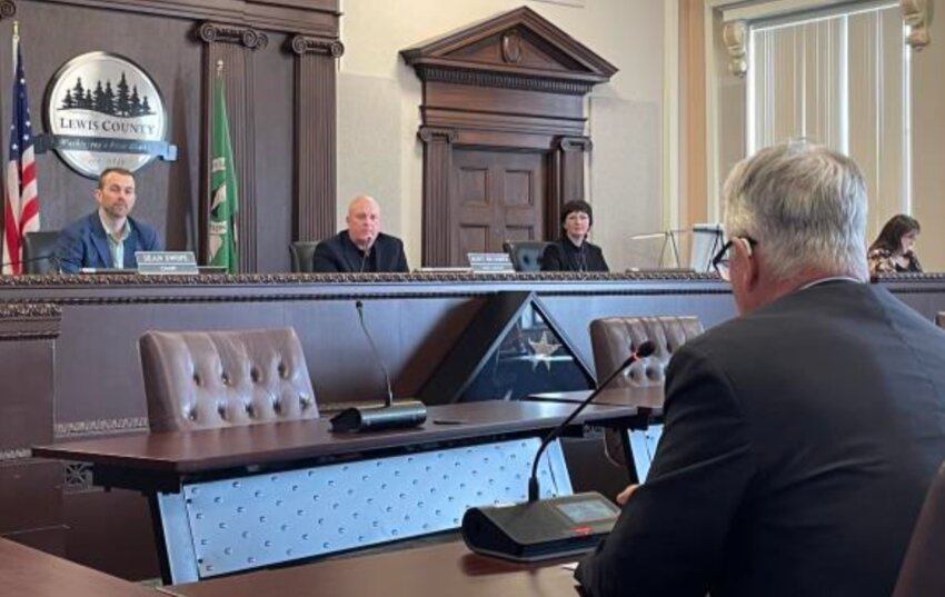 ToledoTel VP/COO Dale Merten presents an update on the Winlock broadband expansion project to Lewis County Commissioners April 25.