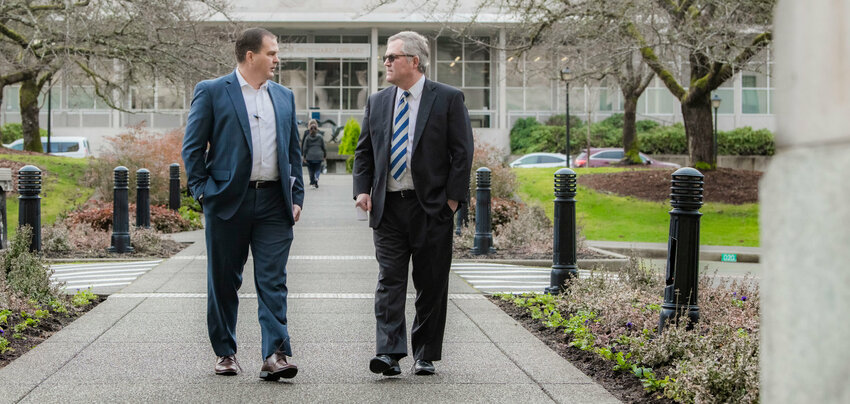 Sen. John Braun, R-Centralia, walks alongside State Rep. J.T. Wilcox, R-Yelm, outside the Washington State Capitol Building in Olympia in January.