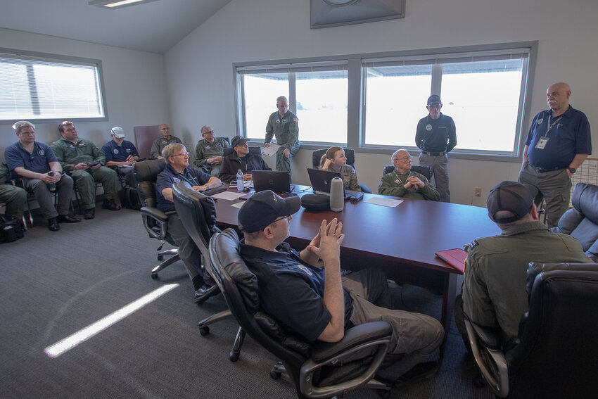 Acting incident commander Civil Air Patrol Lt. Col. Sid Wiggs addresses flight crews on their mission overview Saturday morning at the Chehalis-Centralia Airport as the crews prepared to participate in a search and rescue exercise.