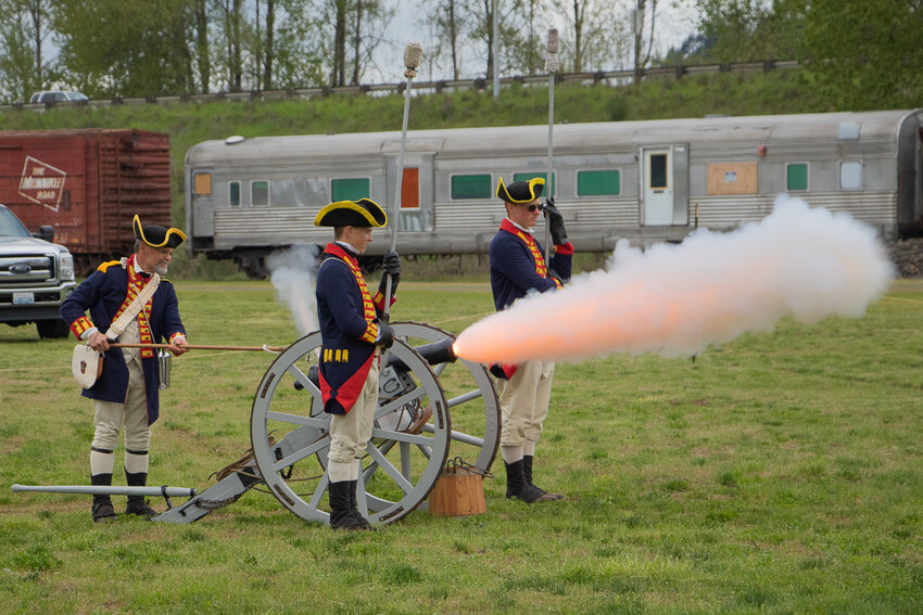 Members of the Spirit of 76 Living History Association fire off a replica cannon Sunday afternoon outside of the Veterans Memorial Museum in Chehalis as part of their living history encampment.