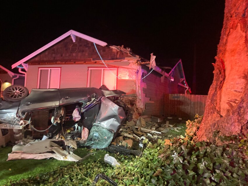 A car in Spanaway went airborne and struck the corner roof of a home early Thursday morning, leaving the driver dead and a passenger in critical condition, the Pierce County Sheriff's Department reported.