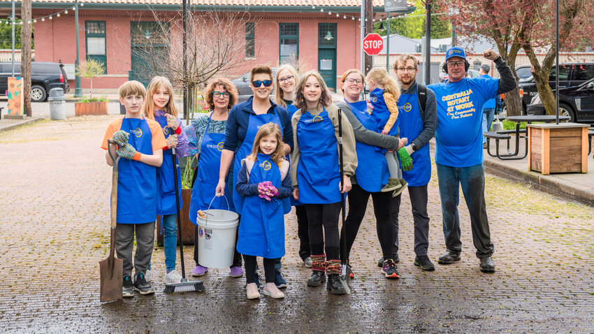 Volunteers pose for a photo while working to clean up the streets of downtown Centralia in May 2023.