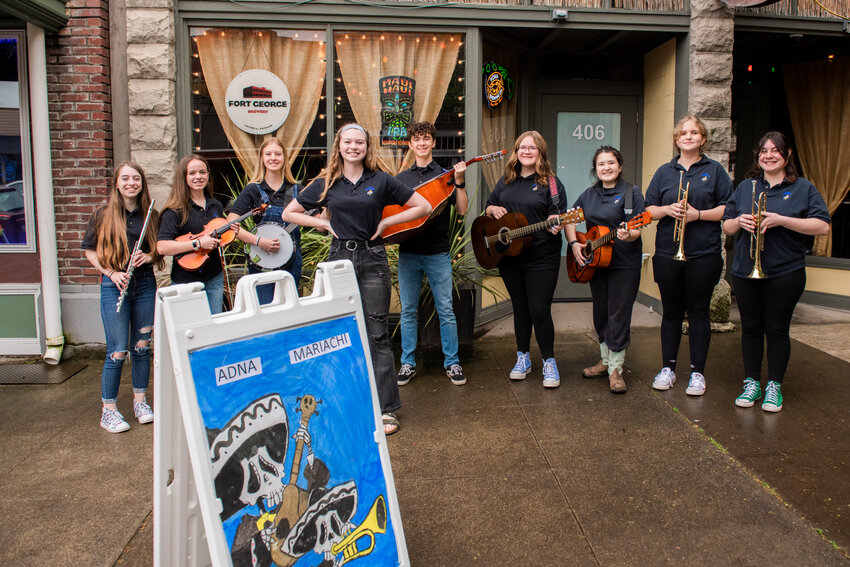 Members of the Adna Mariachi Ensemble pose for a photo outside the Tiki Taphouse in Centralia on Saturday after playing music at various downtown businesses for Cinco de Mayo.