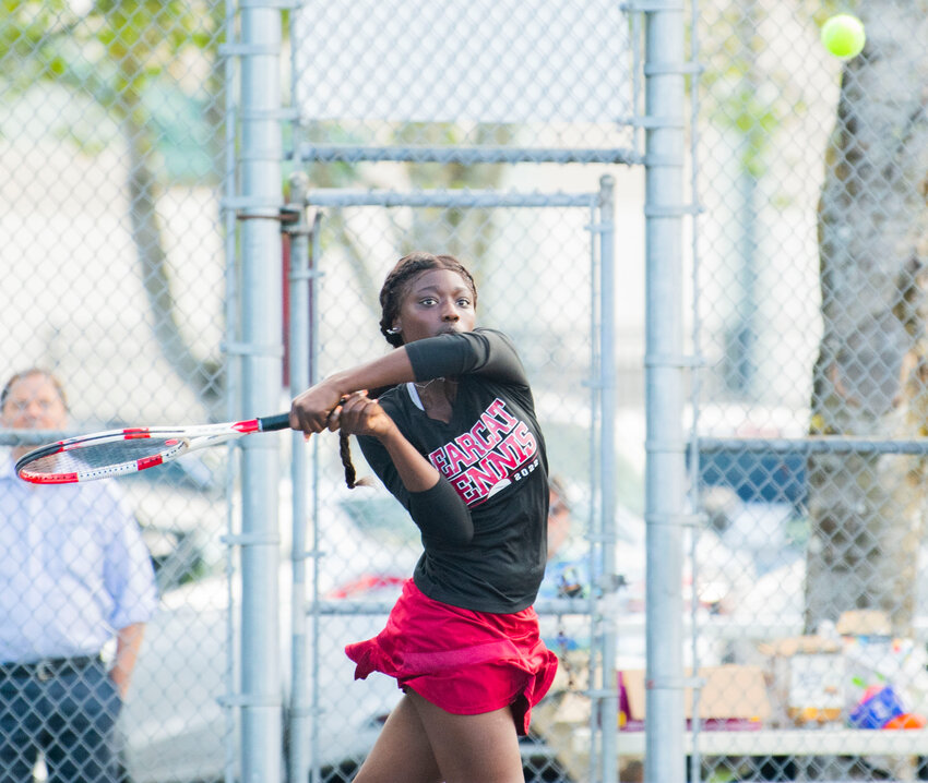 W.F. West first singles player Mariana Ceesay hits a backhand during the Evergeen Conference league championship match against Shelton&rsquo;s Hannah Pratt on the Black Hills courts on Tuesday.