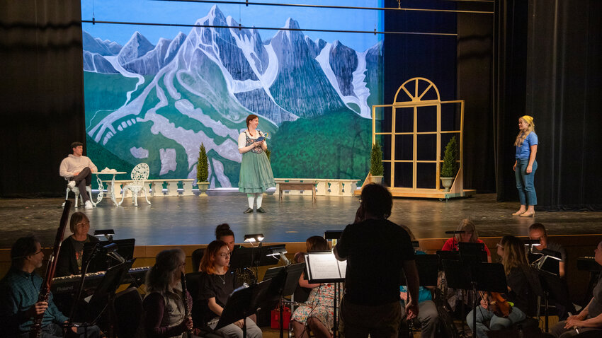 From left, Chris Cabrera, playing Captain von Trapp, Odette Mohr playing Sister Margaretta and Olivia Wiley playing Maria Rainer, perform on stage during rehearsals for &ldquo;The Sound of Music,&rdquo; play at Centralia College on Tuesday, May 9.