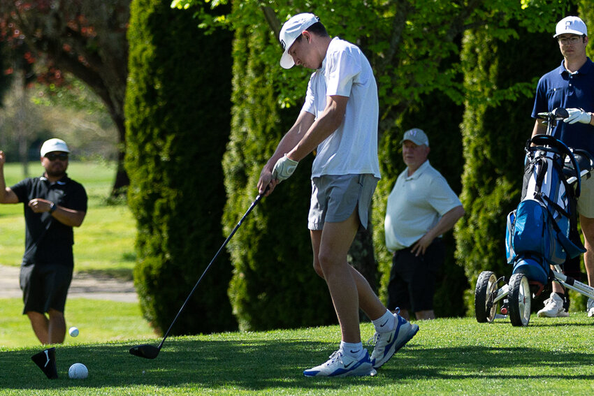 Adna's Braeden Salme takes a swing at Riverside Golf Course May 10.