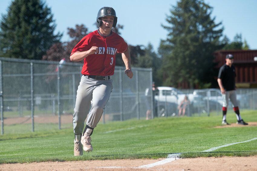 Easton Snider comes home to score a run during Tenino's winner-to-State game against Seton Catholic on May 12 at Castle Rock.