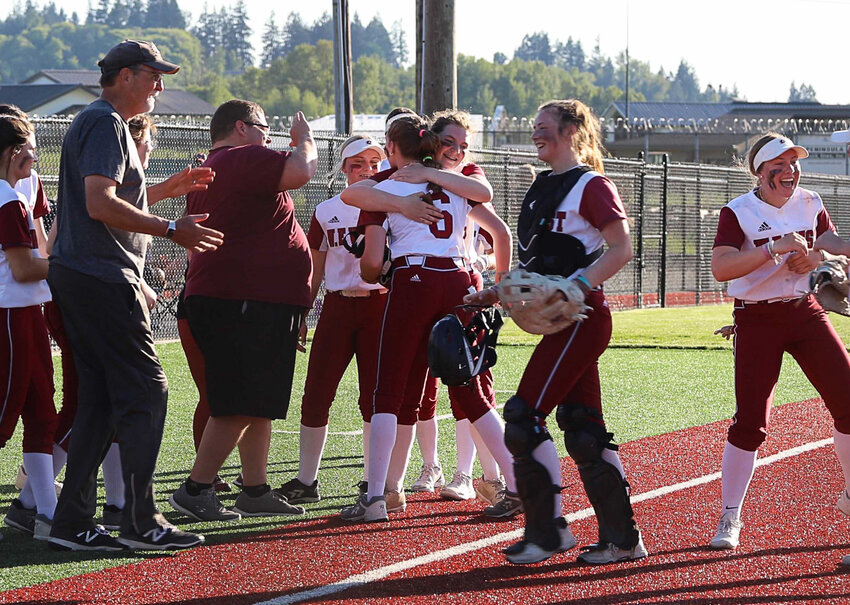 The W.F. West softball team celebrates defeating Rochester in a play-in to the district pigtail game May 12 at Rec Park.