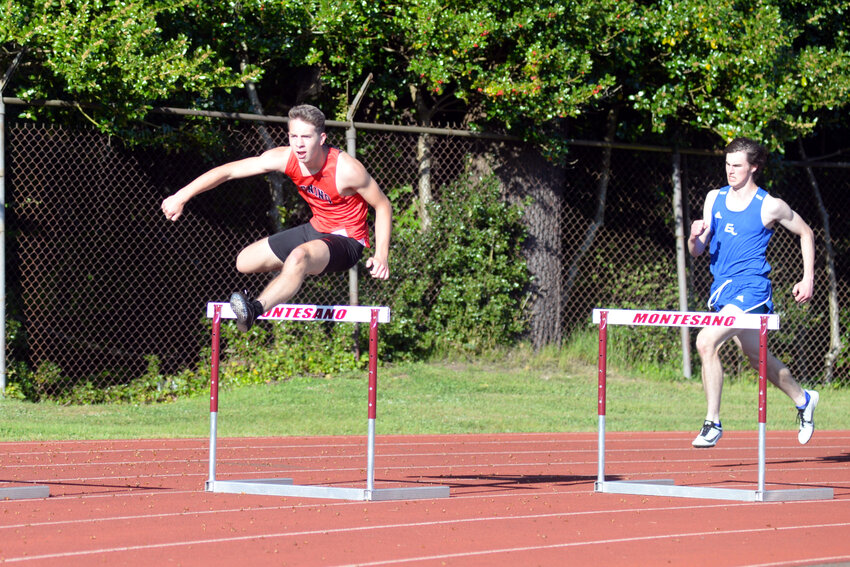 Carson Schall runs the 300-meter hurdles at the 1A Evergreen League Championships in Montesano on May 12.