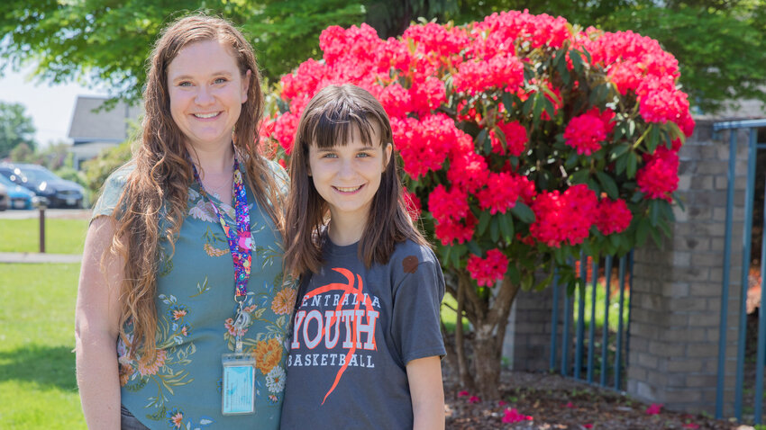 Sara Alvarado, Centralia School District K-6 elementary specialist, smiles and poses for a photo in Centralia alongside Teagan Christensen, a sixth-grader, with poetry being published in the next edition of Stone Soup Magazine, Tuesday, May 16.