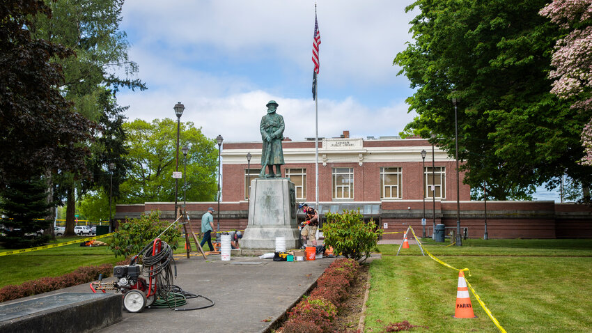 Crews from the Bricklayers Union Local 1 of Washington work to restore monuments at George Washington Park in Centralia on Tuesday, May 16.