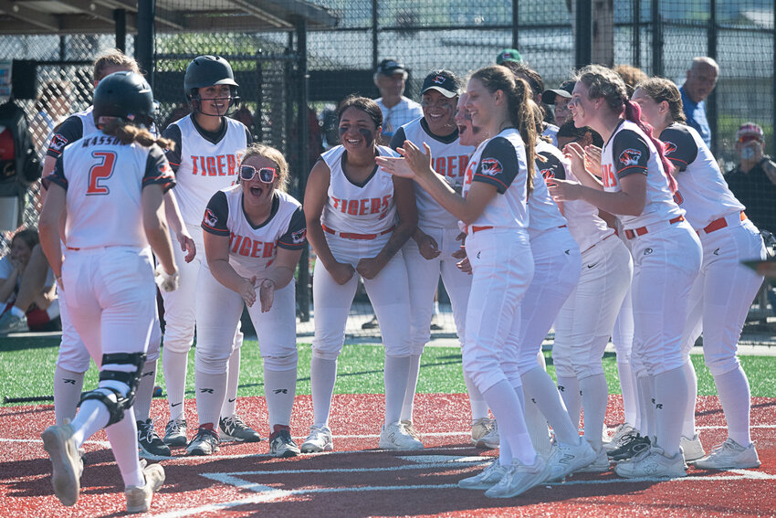 Centralia celebrates Lauren Wasson's home run, which ended up being the game-winning run of the Tigers' 3-2 win over R.A. Long in the quarterfinals of the 2A District 4 tournament, May 18 at Rec Park in Chehalis.