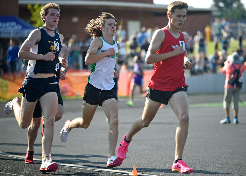 Shelton&rsquo;s Jacob Miller, right, is trailed closely by Tumwter&rsquo;s John Hoffer, center, and Aberdeen&rsquo;s Will Boling in the boys 1,600 meters at the Class 2A District 4 track and field meet on Friday, May 19, 2023, at Columbia River High School. (Will Denner/The Columbian)