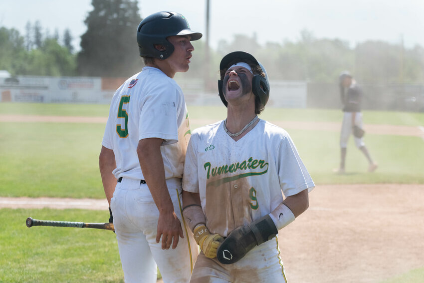 Eddie Marson celebrates after scoring a run during  Tumwater's 8-2 win over Grandview in the first round of the 2A state tournament, May 20 at Wheeler Field in Centralia.