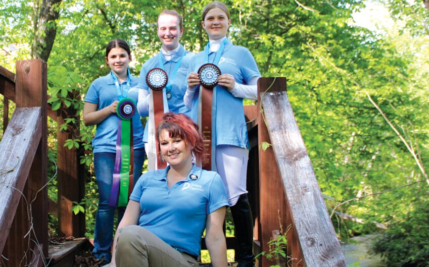 Courtesy Photos  Centralia Middle Schooler Kayla Sneller, 12, her teammates and coach participate in the Interscholastic Equestrian Association National Dressage Finals.