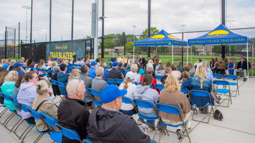 Centralia College President Bob Mohrbacher introduces Athletic Director Bob Peters during a field dedication ceremony in Centralia on Monday, May 22.