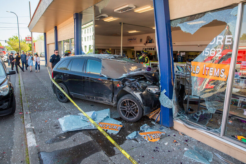 Caution tape surrounds a scene at Visiting Nurses in Centralia after a vehicle crashed through windows, destroying shelves full of items, at the location Thursday morning.