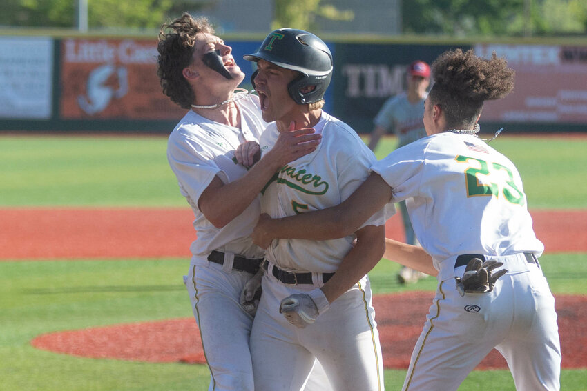Tumwater's Kyler Collier celebrates his walk-off sacrifice against W.F. West in the 2A State semifinals at Joe Martin Stadium in Bellingham May 26.