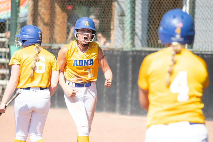 Danika Hallom celebrates after scoring Adna's first run in its 8-7 win over Ocosta in a semifinal at the 2B state tournament, May 27 in Yakima.