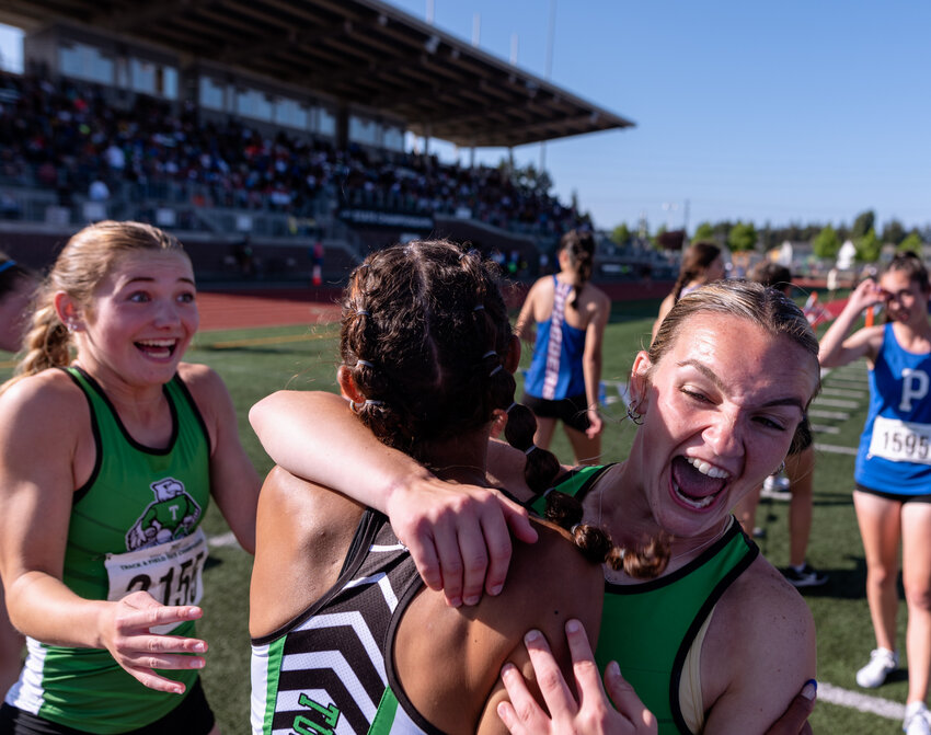 Tumwater&rsquo;s Reese Heryford hugs Ava Jones in excitement of winning the 2A girls team title following their victory in the 4x400 relay at the WIAA 2A/3A/4A State Track and Field Championships on Saturday, May 27, 2023, at Mount Tahoma High School in Tacoma. (Joshua Hart/For The Chronicle)