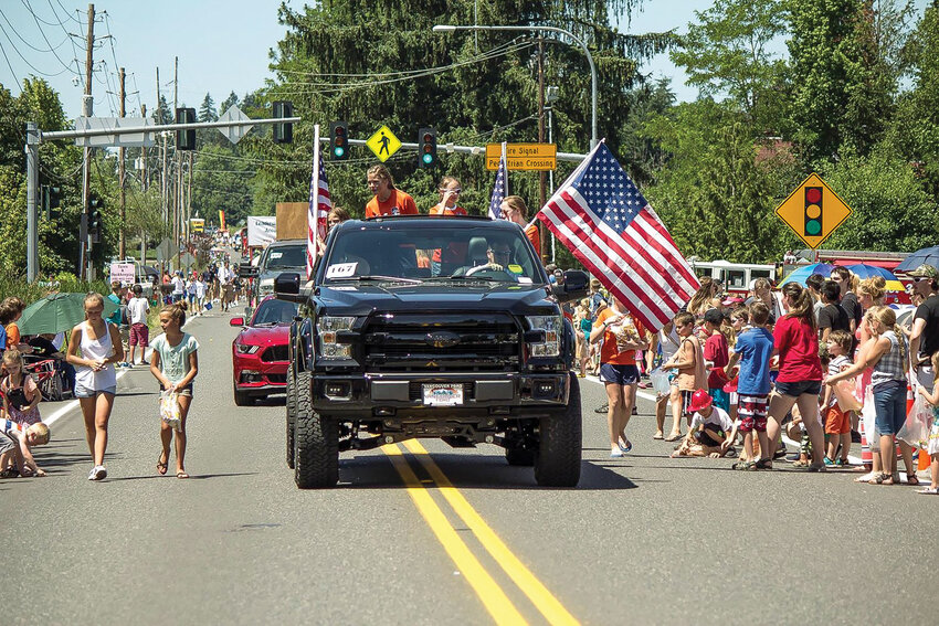 Participants in a previous Hockinson Fun Days Parade hand out candy to kids. This year&rsquo;s event will take place at noon on Saturday, June 3.