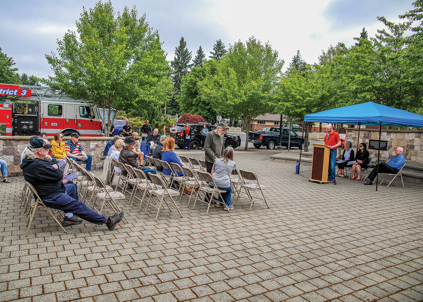 Visitors gather during a Memorial Day ceremony at the Battle Ground Veterans Memorial in Kiwanis Park on Monday, May 29.