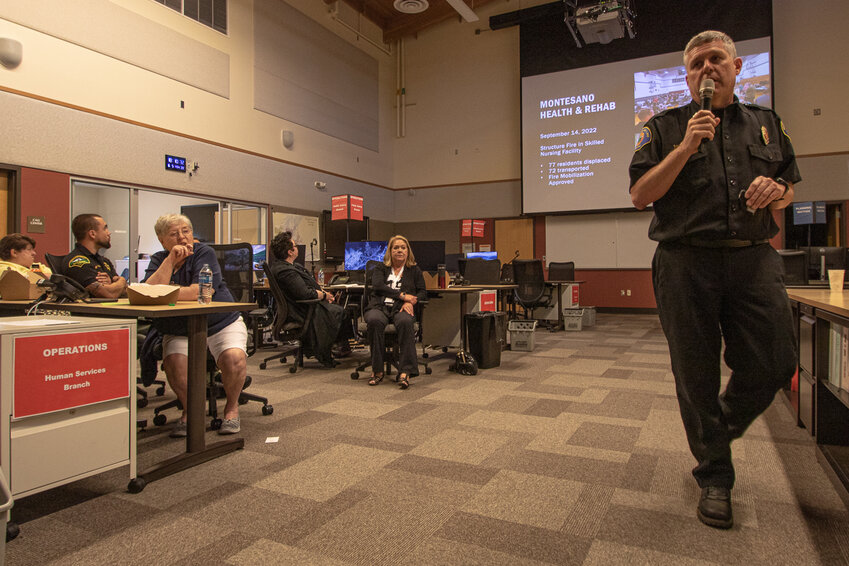 McLane Black Lake Fire Chief Leonard Johnson briefs county and city officials from Thurston County on the upcoming wildfire season forecast from the National Interagency Fire Center at the Thurston County Emergency Management building on Monday.