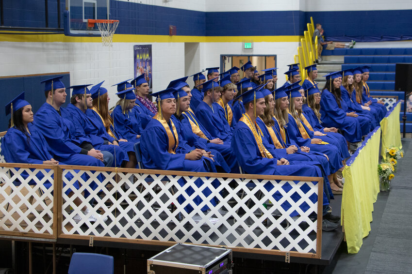 FILE PHOTO &mdash;&nbsp;The graduating senior class of Adna High School sits on stage during their commencement ceremony in June 2023.