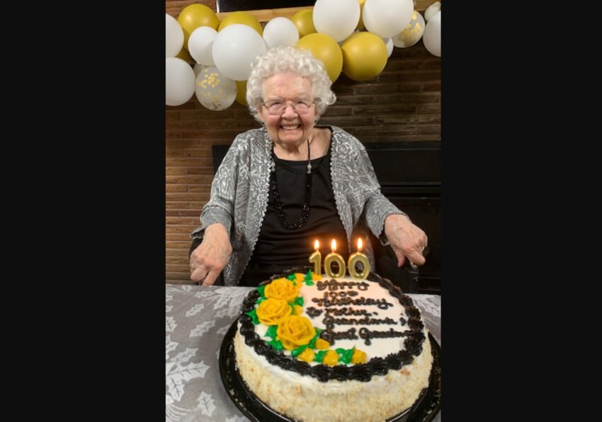 Grace G. Born is pictured behind a cake during a celebration for her 100th birthday in this photo provided to The Chronicle.