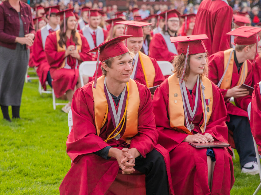 W.F. West graduate Samuel Mittge, left, prepares to turn his tassel at Bearcat Stadium in Chehalis on Saturday, June 10.