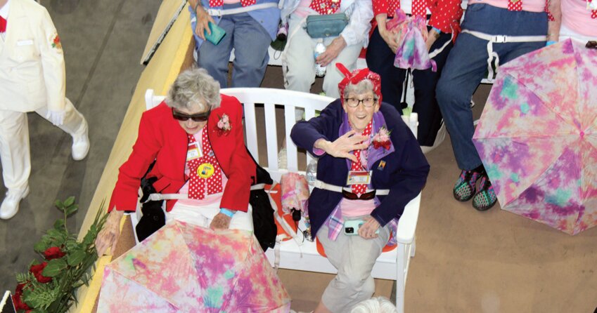 Riding on the Boeing Co.-sponsored floral float was 95-year-old Doris Bier of Chehalis, pictured here wearing the red bandana.