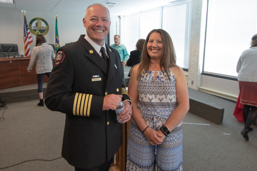 New Chehalis Fire Chief Adam Fulbright stands next to his wife, Diana, in Chehalis City Hall Monday early Monday evening during a reception held to welcome him to the city. Diana Fulbright also serves as a captain in the South Beach Regional Fire Authority.