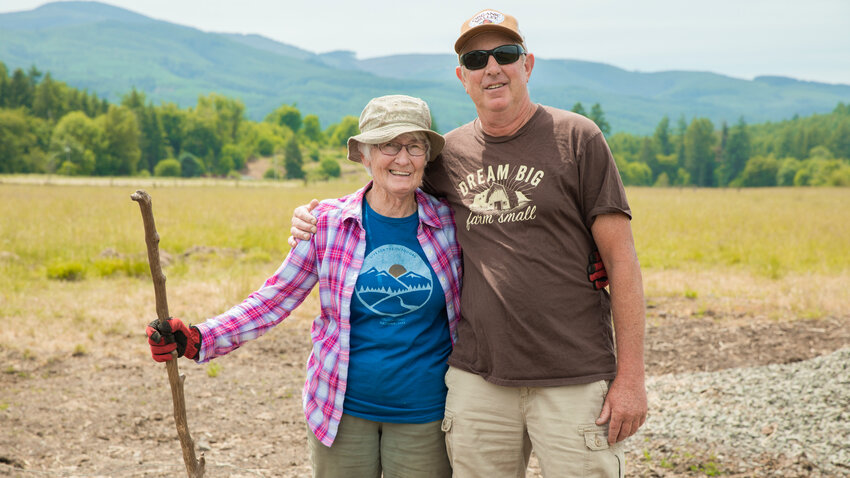 Mary Mallonee and her son Maynard smile for a photo while walking through her field off Boistfort Road in Curtis.