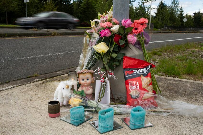 A memorial appeared last year at the intersection of Southwest Barrows Road and Horizon Boulevard in Beaverton, near where Milana Li, 13, was found dead in a stream.