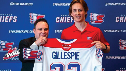 Brody Gillespie poses with his new Spokane Chiefs jersey after being drafted in the Western Hockey League U.S. Priority Draft.