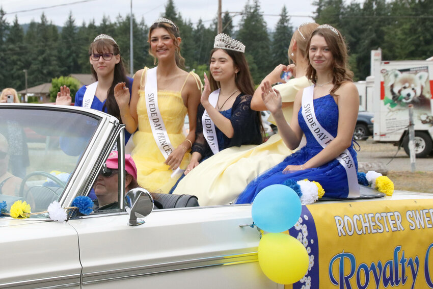 Members of the Rochester Swede Day Royalty Court wave from a float during the Swede Day Parade in Rochester on Saturday, June 17.