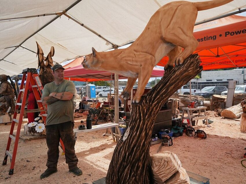 Carver Nick Bielby of Port Angeles, Washington with his entry in the  2023 Oregon Divisional Chainsaw Carving Championship in Reedsport.