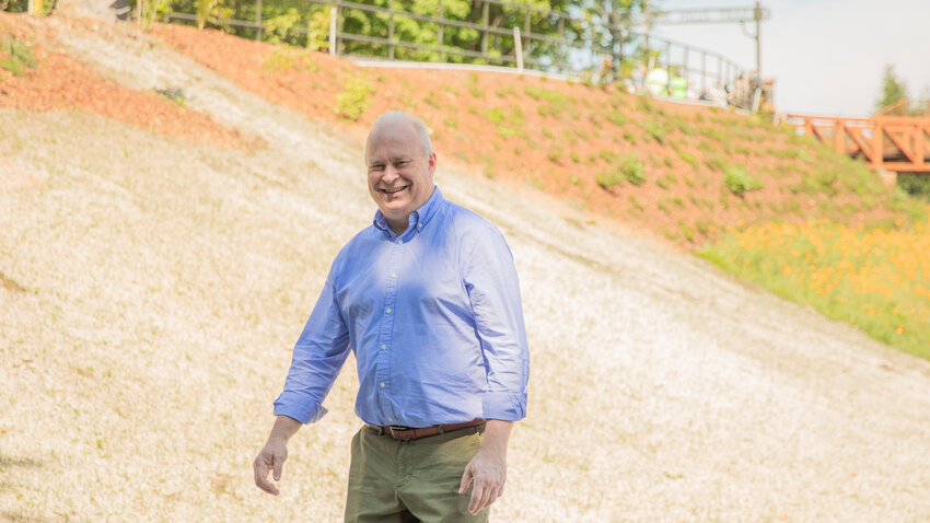 FILE PHOTO &mdash; State Rep. Jim Walsh smiles while attending a ceremony along the Willapa Hills State Park Trail in June.