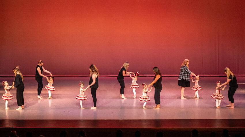 Parents dance with their children during the Southwest Washington Dance Center 39th Annual &quot;Spring Into Summer&quot; performance at Corbet Theater at Centralia College, Thursday evening, June 22, 2023.