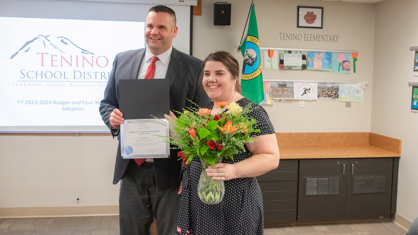 Holly Johnson smiles as she receives flowers and a certificate of recognition for her Regional Teacher of the Year Award in Tenino on Monday, June 26.