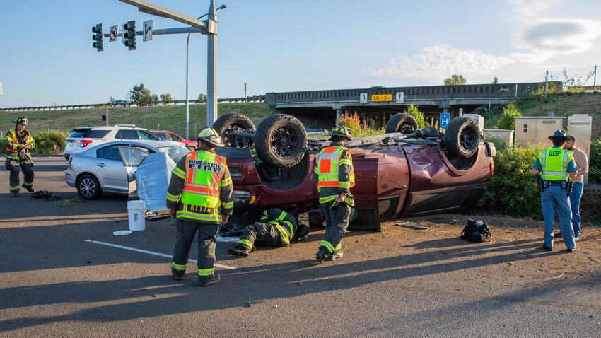The Riverside Fire Authority and the Washington State Patrol respond to the scene of a rollover crash involving multiple vehicles on the Mellen Street on-ramp to Interstate 5 in Centralia on Monday, June 26. The on-ramp was closed for a period of time as emergency crews worked at the scene.