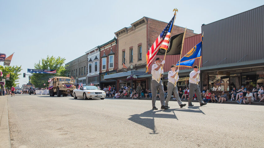 A color guard follows a Centralia police cruiser at the front of the Summerfest parade in downtown Centralia on Tuesday, July 4, 2024.