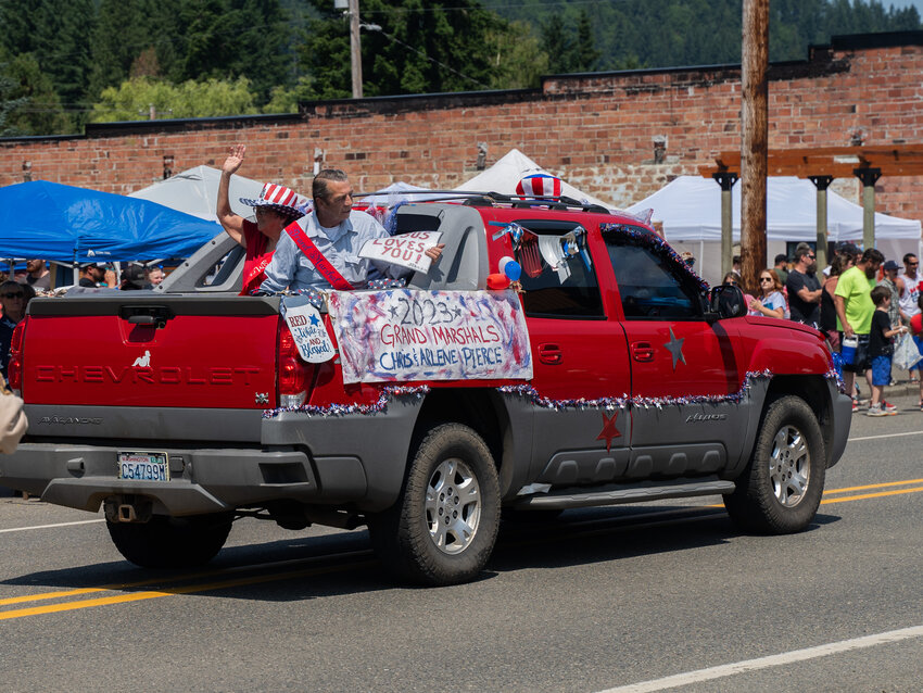 Grand Marshals Chris Pierce and Adeline Pierce lead the Pe Ell Fourth of July parade, Tuesday, July 4, 2023