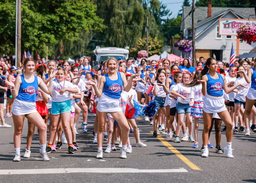 Ridgefield&rsquo;s cheer program gives a demonstration on North Third Avenue during the parade on Tuesday, July 4.